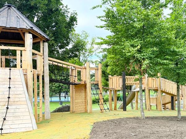 The rebuilt play park: the timber tower, climbing wall and rope bridge
