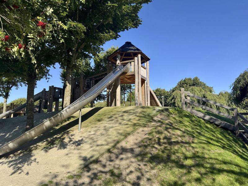 The timber tower and its slide, set into the mound